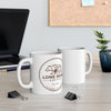 Two white mugs with a bear logo and 'Lone Bear Coffee' text on a desk with office supplies.