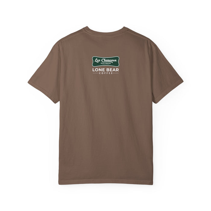Man wearing a brown Dave the Roaster 'He Roasts, I Exist' T-shirt, 100% cotton apparel for coffee enthusiasts.