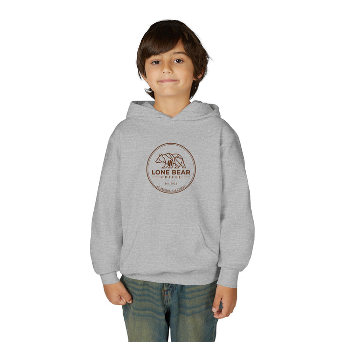 Young boy smiling, wearing a grey Lone Bear Cub Hoodie with the brand's circular bear logo visible on the chest.