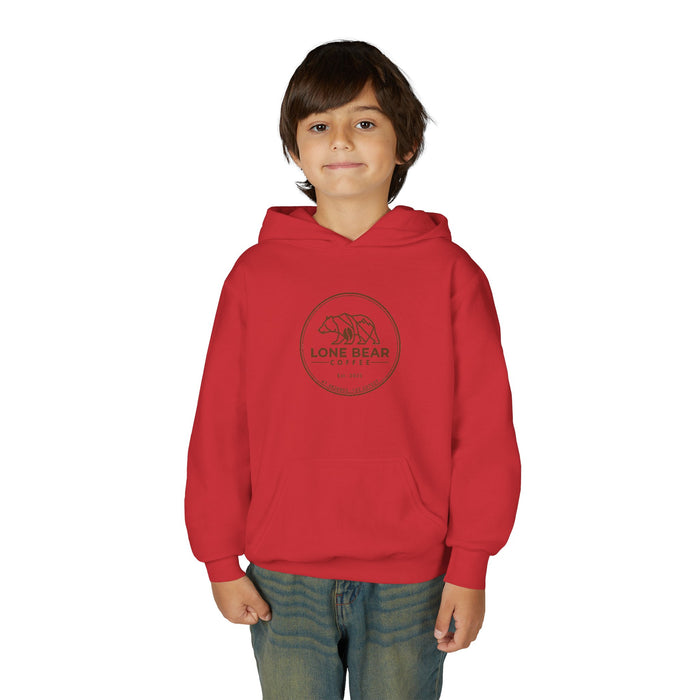 Young boy smiling, wearing a red Lone Bear Cub Hoodie with the brand's circular bear logo visible on the chest.