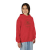 Young girl smiling, wearing a red Lone Bear Cub Hoodie with the brand's circular bear logo visible on the chest.