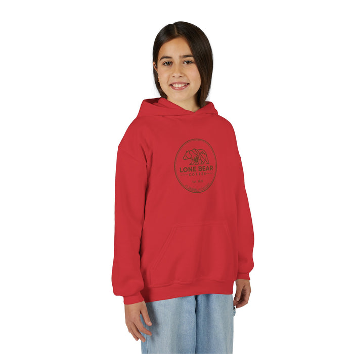Young girl smiling, wearing a red Lone Bear Cub Hoodie with the brand's circular bear logo visible on the chest.