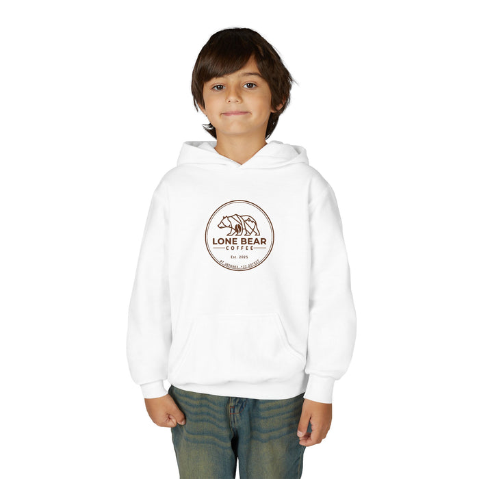 Young boy smiling, wearing a white Lone Bear Cub Hoodie with the brand's circular bear logo visible on the chest.