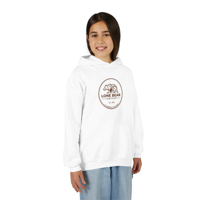 Young girl smiling, wearing a white Lone Bear Cub Hoodie with the brand's circular bear logo visible on the chest.