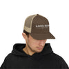 Man wearing a brown and beige cap with 'Lone Bear Coffee' logo on a white background