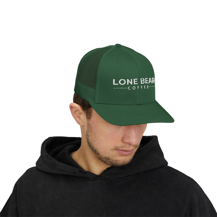 Man wearing a green cap with 'Lone Bear Coffee' logo on a white background