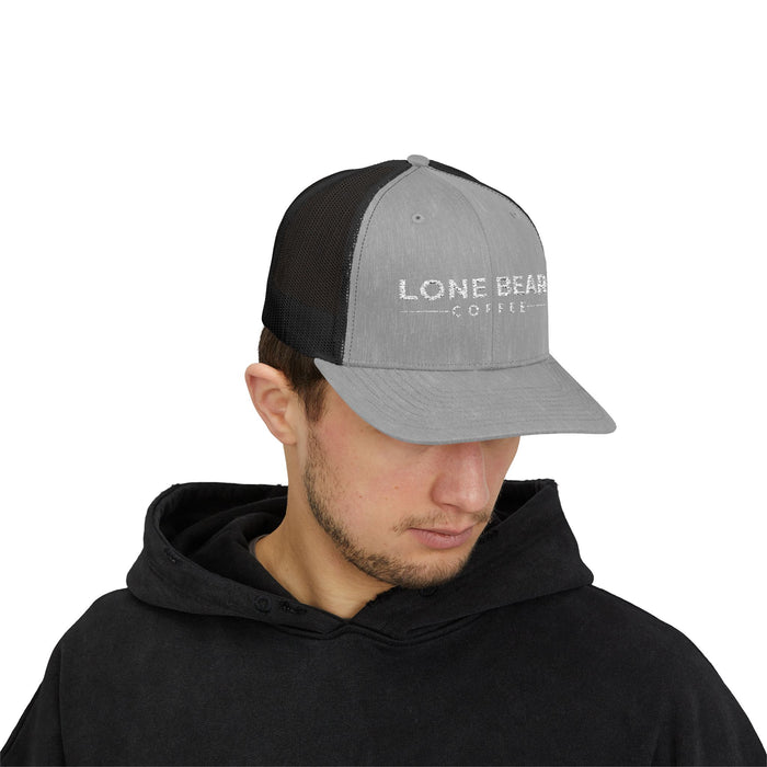 Person wearing a gray and black cap with 'Lone Bear Coffee' logo on a white background