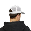 Person wearing a black hoodie and white and gray cap on a white background