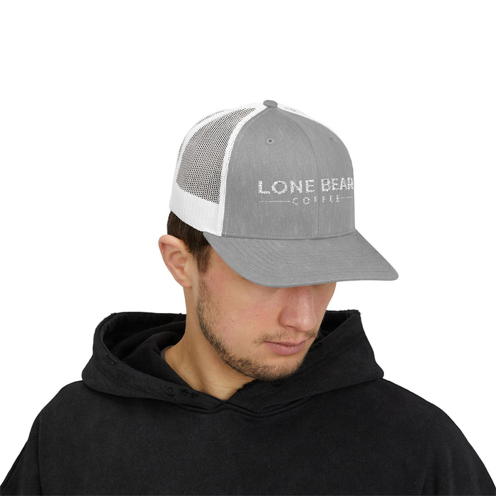 Man wearing a gray and white cap with 'Lone Bear Coffee' logo on a white background