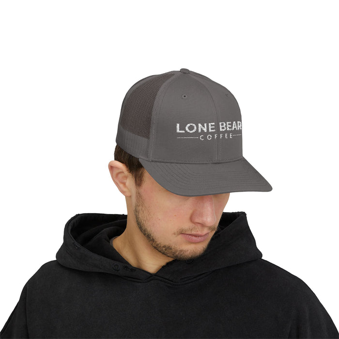 Man wearing a gray cap with 'Lone Bear Coffee' logo on a white background