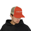 Man wearing a red and beige cap with 'Lone Bear Coffee' logo on a white background