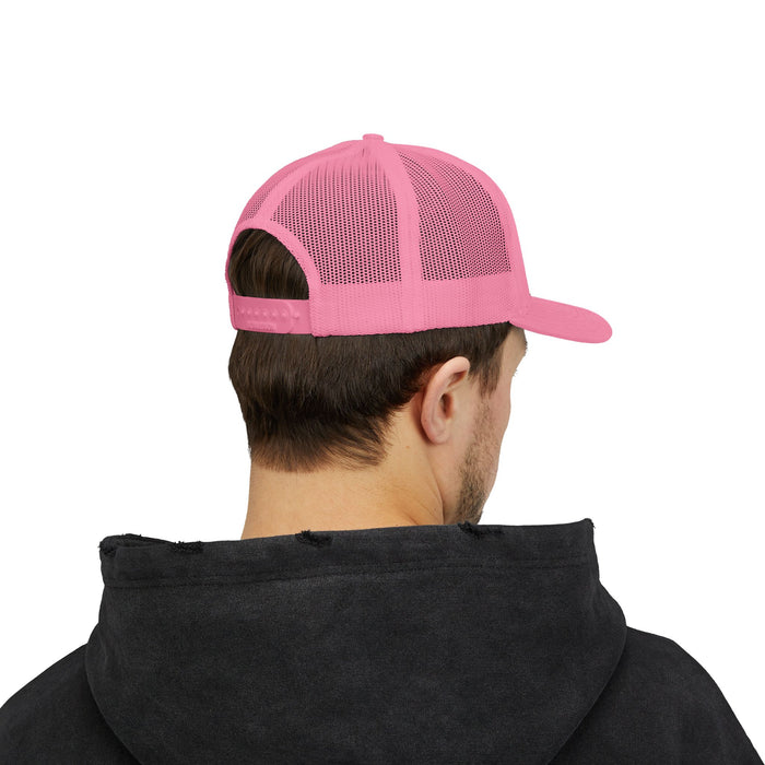 Person wearing a pink cap and black hoodie on a white background
