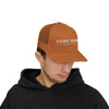 Man wearing a brown cap with 'Lone Bear Coffee' logo on a white background