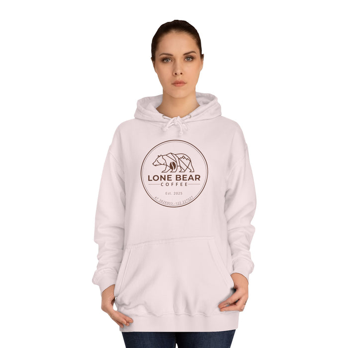Woman wearing a light pink hoodie with 'Lone Bear Coffee' logo on a white background